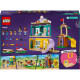 LEGO Friends Školka v městečku Heartlake s minipanenkami, herními prvky a doplňky pro péči o nejmenší obyvatele školky. Dvě minipanenky si hrají s dětmi v herní místnosti plné hraček, s prolézačkou a dětskými potřebami.