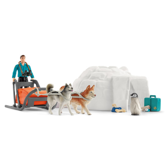 Schleich Antarktická expedice: Ranger Tom s husky a tučňákem v zasněžené antarktické krajině.