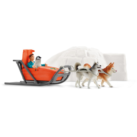 Schleich Antarktická expedice: Ranger Tom s husky a tučňákem v zasněžené antarktické krajině.